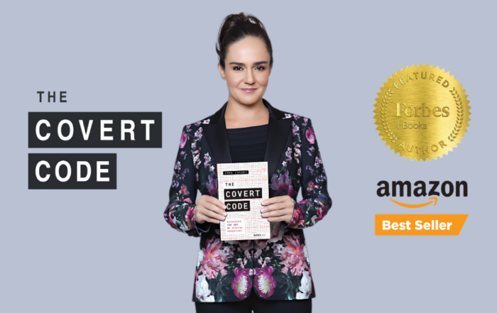 Anna Covert holding her book "The Covert Code," which is an Amazon Best Seller and featured by Forbes.